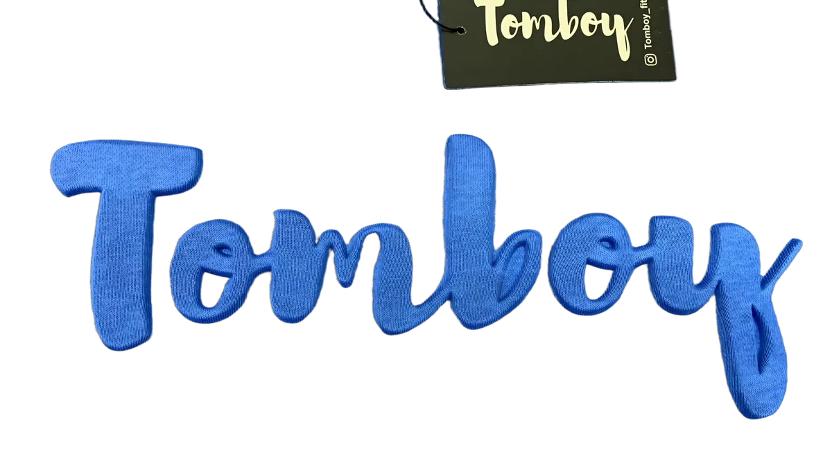 Tomboy — embossed logo detail
